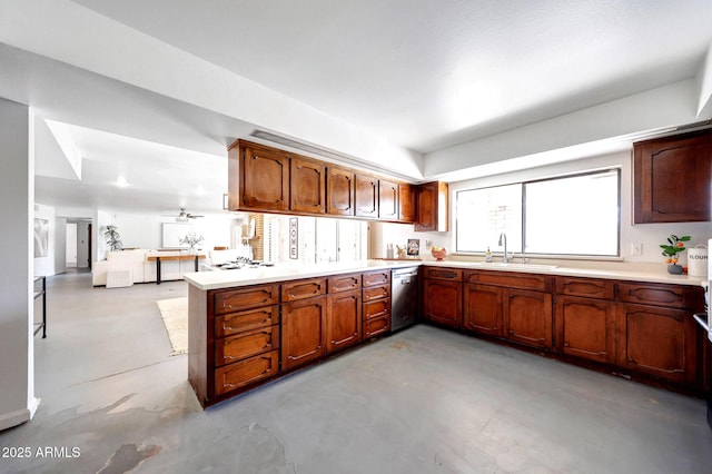 1106 N Villa Nueva Dr, Litchfield Park, AZ 85340 - kitchen with a sink, stainless steel dishwasher, concrete floors, and a peninsula