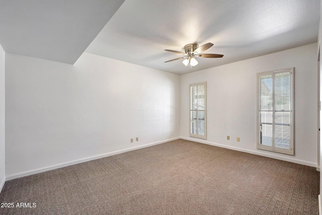 1106 N Villa Nueva Dr, Litchfield Park, AZ 85340 - empty room with ceiling fan, carpet flooring, and baseboards