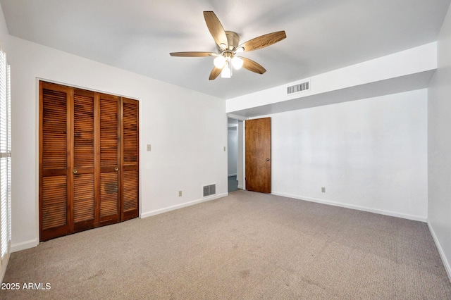 1106 N Villa Nueva Dr, Litchfield Park, AZ 85340 - unfurnished bedroom featuring a closet, light carpet, and baseboards