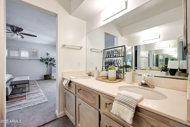 1106 N Villa Nueva Dr, Litchfield Park, AZ 85340 - full bathroom featuring ceiling fan, double vanity, and baseboards