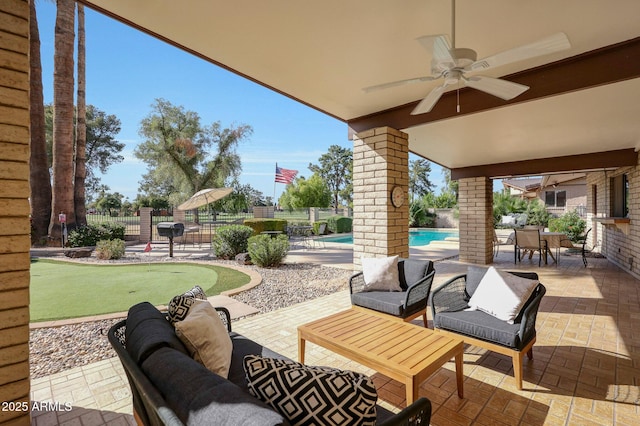 1106 N Villa Nueva Dr, Litchfield Park, AZ 85340 - view of patio featuring an area to practice putting, a ceiling fan, an outdoor hangout area, and fence