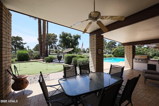 1106 N Villa Nueva Dr, Litchfield Park, AZ 85340 - view of patio with a putting green, area for grilling, ceiling fan, and an outdoor pool
