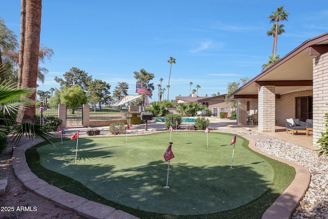 1106 N Villa Nueva Dr, Litchfield Park, AZ 85340 - surrounding community with a putting area, a patio area, and fence