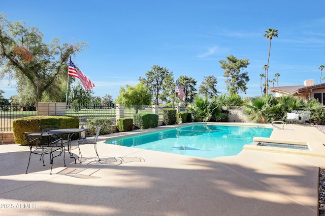 1106 N Villa Nueva Dr, Litchfield Park, AZ 85340 - view of swimming pool with a patio area, a fenced backyard, and a hot tub