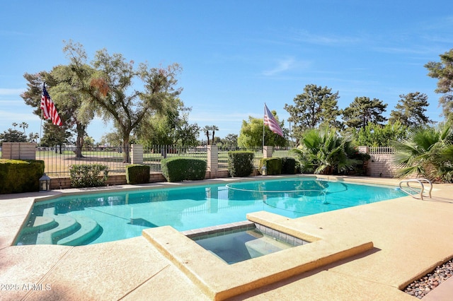 1106 N Villa Nueva Dr, Litchfield Park, AZ 85340 - view of pool with a fenced backyard, a pool with connected hot tub, and a patio area