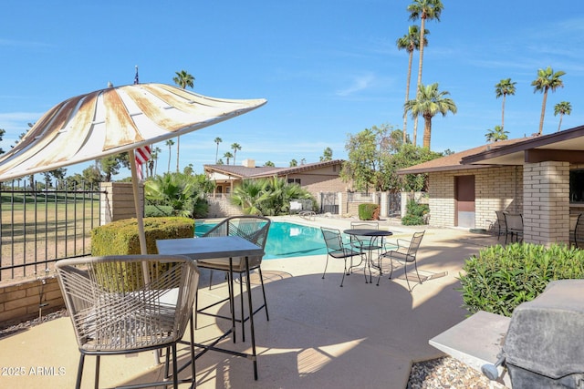 1106 N Villa Nueva Dr, Litchfield Park, AZ 85340 - view of pool featuring a patio area, fence, and outdoor dining area