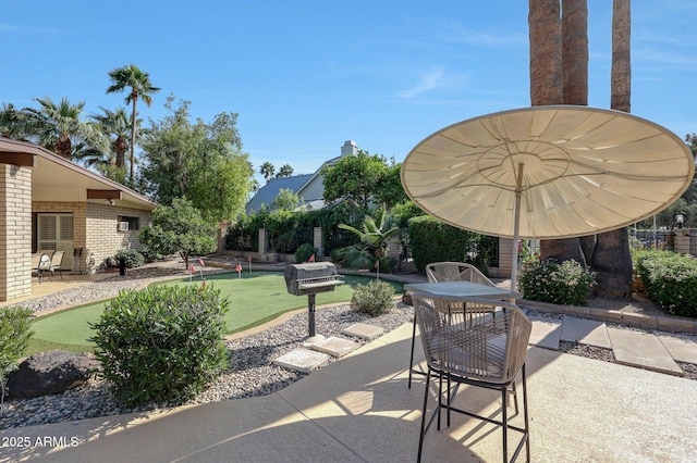 1106 N Villa Nueva Dr, Litchfield Park, AZ 85340 - view of patio / terrace with a putting green and outdoor dining space