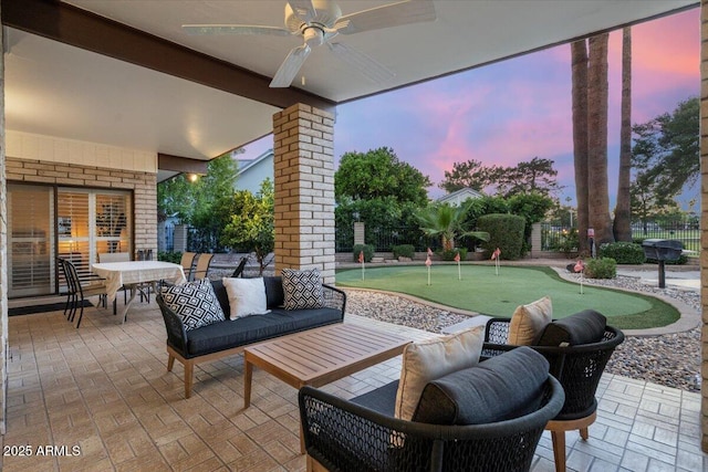 1106 N Villa Nueva Dr, Litchfield Park, AZ 85340 - view of patio / terrace featuring a putting green, a ceiling fan, fence, and outdoor dining area