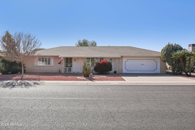 ranch-style home featuring a garage