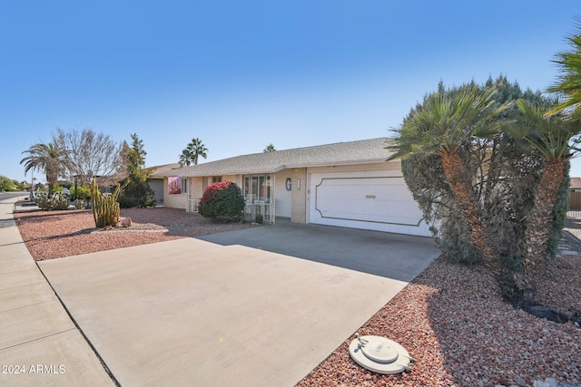 ranch-style home featuring a garage