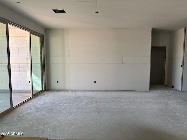 empty room featuring unfinished concrete flooring