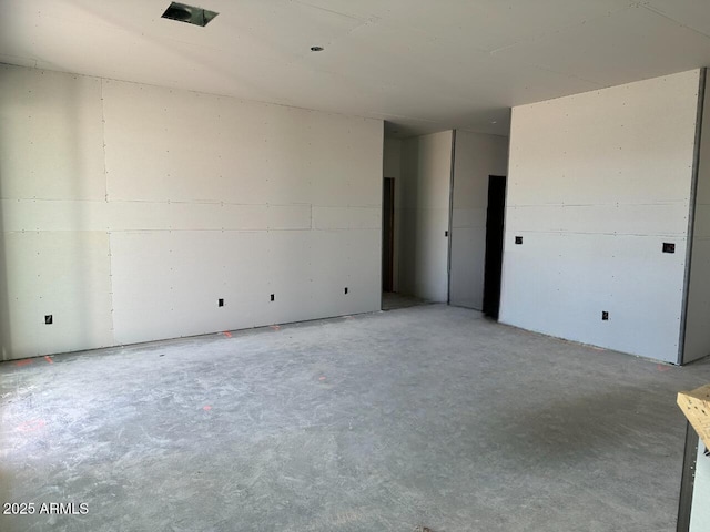 spare room featuring concrete floors