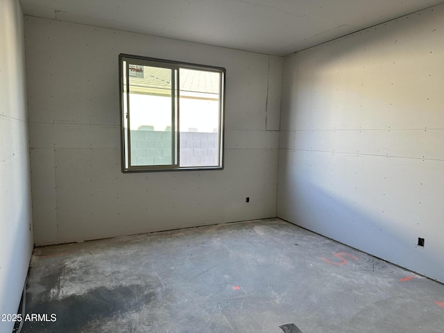 empty room with unfinished concrete floors