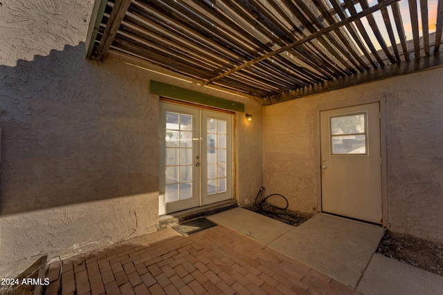 property entrance featuring french doors