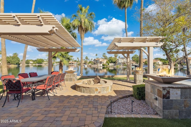 1241 W Lobster Trap Dr, Gilbert, AZ 85233 - view of patio / terrace featuring an outdoor fire pit, a pergola, and a water view