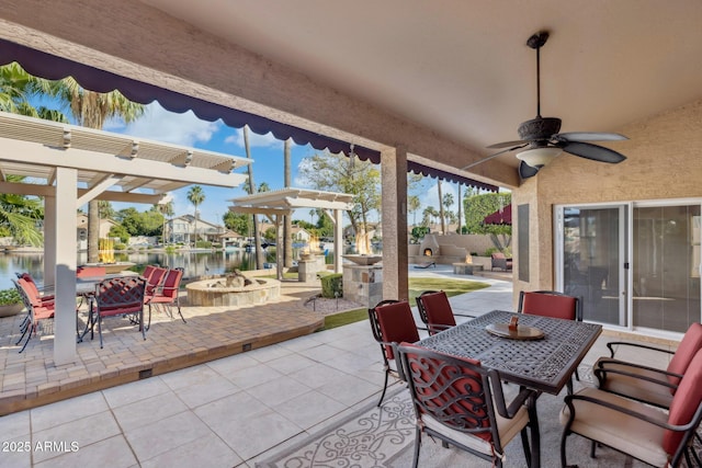 1241 W Lobster Trap Dr, Gilbert, AZ 85233 - view of patio with outdoor dining area, an outdoor fire pit, a water view, and ceiling fan