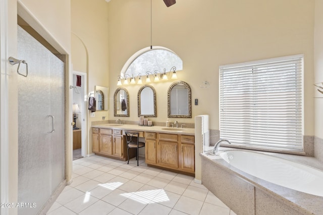 1241 W Lobster Trap Dr, Gilbert, AZ 85233 - full bath with a towering ceiling, a garden tub, a shower stall, double vanity, and tile patterned floors