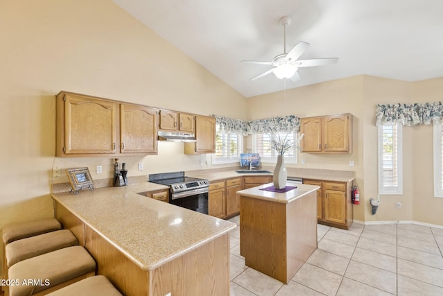 1241 W Lobster Trap Dr, Gilbert, AZ 85233 - kitchen featuring electric stove, under cabinet range hood, ceiling fan, light tile patterned floors, and a peninsula