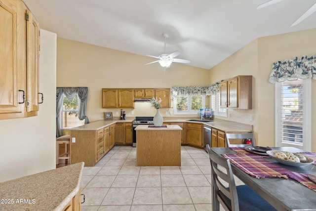 1241 W Lobster Trap Dr, Gilbert, AZ 85233 - kitchen featuring stainless steel appliances, ceiling fan, lofted ceiling, a center island, and light countertops