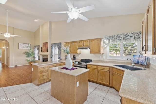 1241 W Lobster Trap Dr, Gilbert, AZ 85233 - kitchen featuring stainless steel electric stove, a ceiling fan, under cabinet range hood, high vaulted ceiling, and light tile patterned flooring