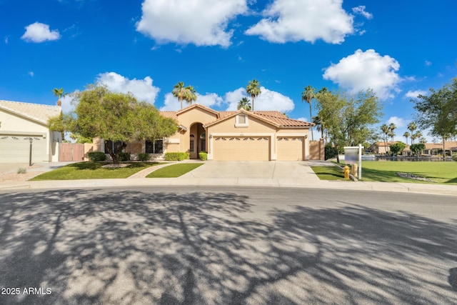 1241 W Lobster Trap Dr, Gilbert, AZ 85233 - mediterranean / spanish-style home featuring an attached garage, stucco siding, concrete driveway, and a tile roof