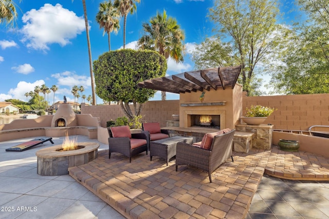 1241 W Lobster Trap Dr, Gilbert, AZ 85233 - view of patio with an outdoor living space with a fireplace