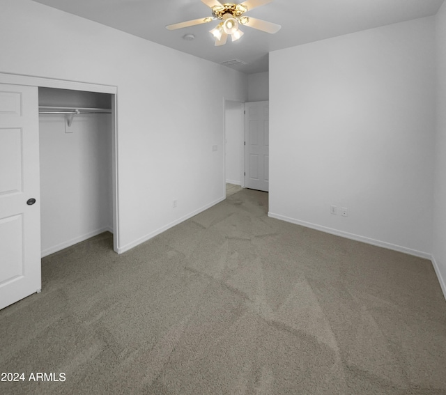 unfurnished bedroom featuring carpet flooring, a closet, and ceiling fan