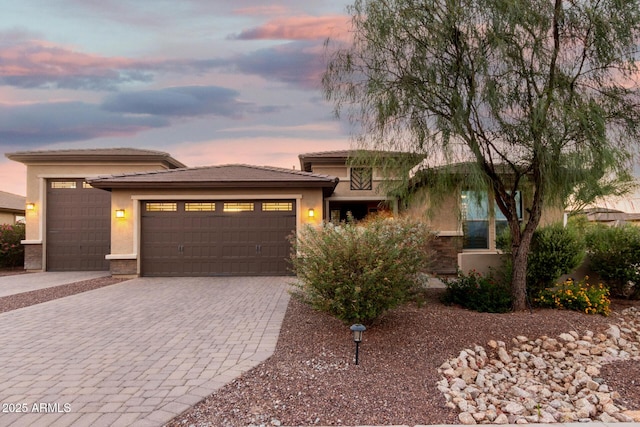 18108 W Cassia Way, Goodyear, AZ 85338 - prairie-style house with an attached garage, decorative driveway, and stucco siding