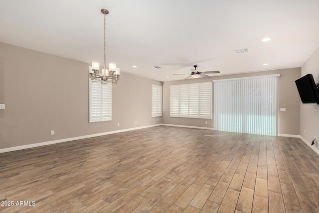 18108 W Cassia Way, Goodyear, AZ 85338 - spare room with ceiling fan, wood finished floors, a chandelier, and recessed lighting