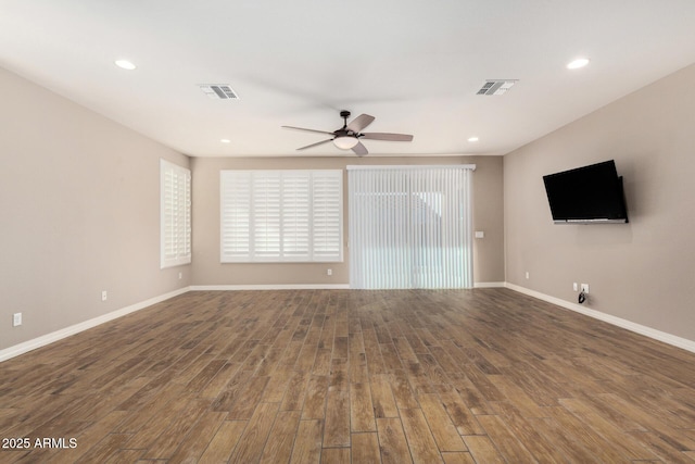 18108 W Cassia Way, Goodyear, AZ 85338 - unfurnished living room with a ceiling fan, wood finished floors, healthy amount of natural light, and recessed lighting