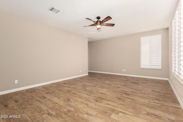 18108 W Cassia Way, Goodyear, AZ 85338 - spare room featuring a ceiling fan and light wood-style floors