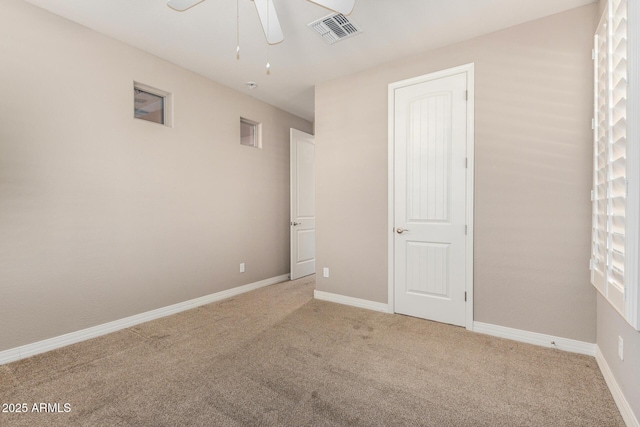18108 W Cassia Way, Goodyear, AZ 85338 - empty room featuring light carpet and ceiling fan