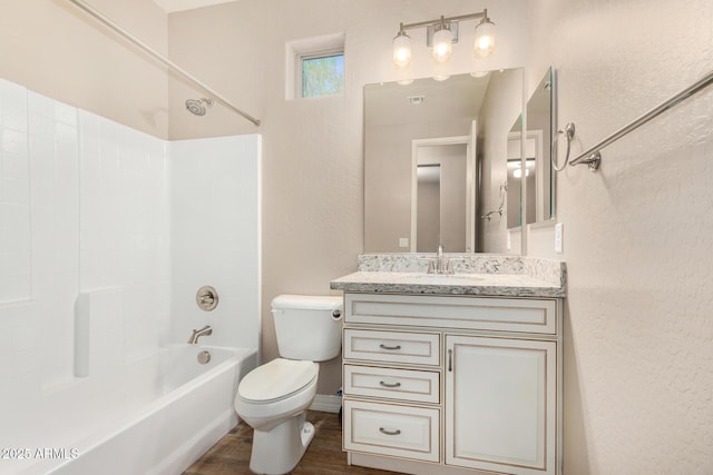 18108 W Cassia Way, Goodyear, AZ 85338 - full bath with vanity, wood finished floors, shower / bathtub combination, and a textured wall
