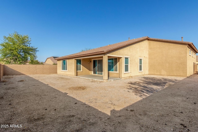 18108 W Cassia Way, Goodyear, AZ 85338 - rear view of house featuring a fenced backyard, a patio area, and stucco siding