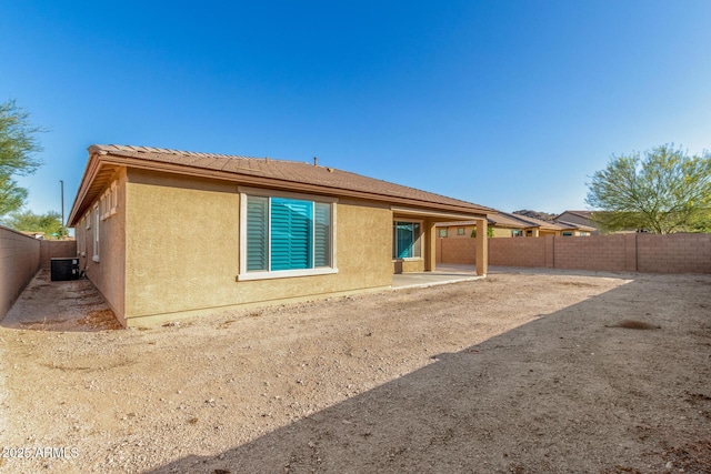 18108 W Cassia Way, Goodyear, AZ 85338 - back of house featuring stucco siding, a fenced backyard, and a patio area