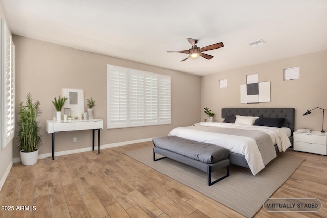 18108 W Cassia Way, Goodyear, AZ 85338 - bedroom featuring wood finished floors and a ceiling fan