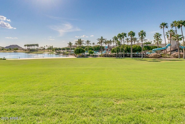 18108 W Cassia Way, Goodyear, AZ 85338 - view of property's community with a water view, a lawn, and golf course view