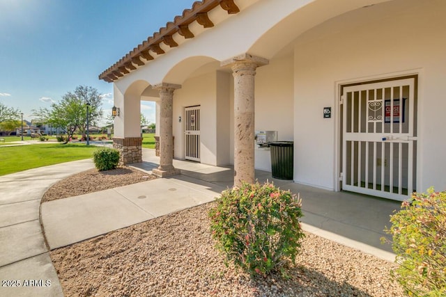 18108 W Cassia Way, Goodyear, AZ 85338 - view of exterior entry featuring stucco siding and a tile roof