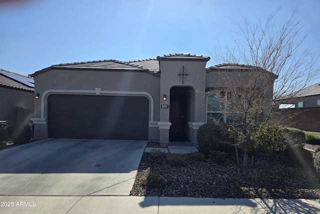 mediterranean / spanish-style home with a garage