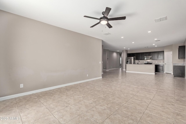 unfurnished living room featuring tile patterned floors and ceiling fan