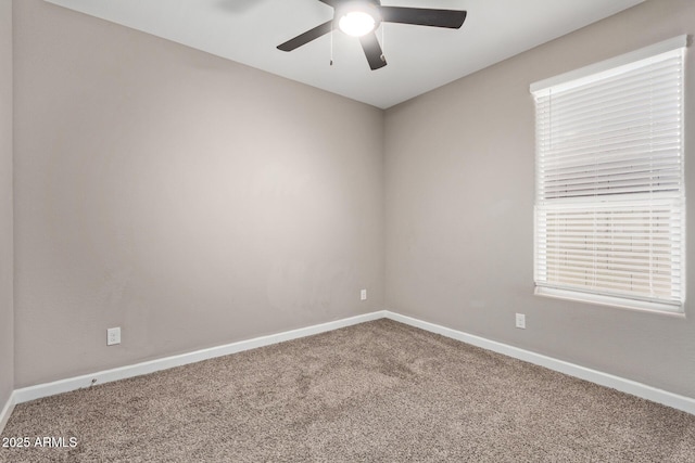 carpeted empty room featuring ceiling fan