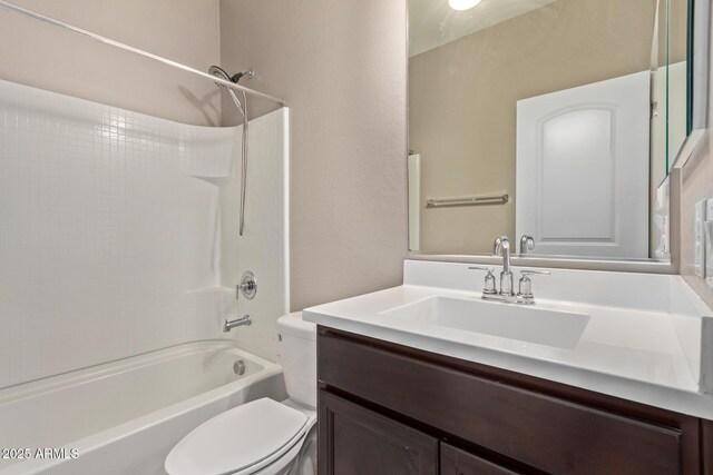 full bathroom with vanity, shower / bathtub combination, and toilet