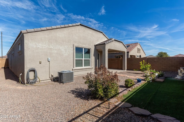 rear view of house with central AC