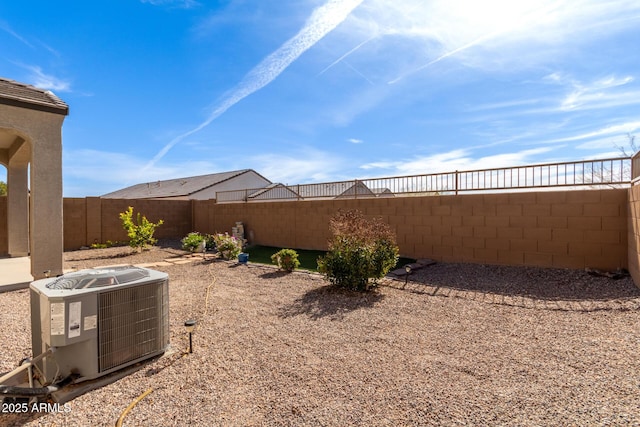 view of yard featuring central air condition unit