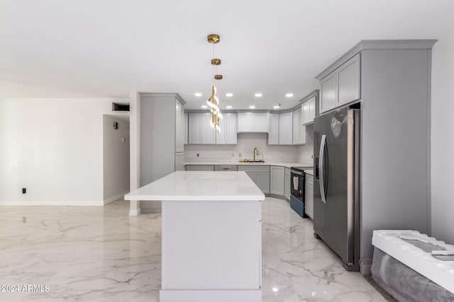 kitchen with stainless steel refrigerator with ice dispenser, range with electric stovetop, hanging light fixtures, light tile patterned floors, and sink