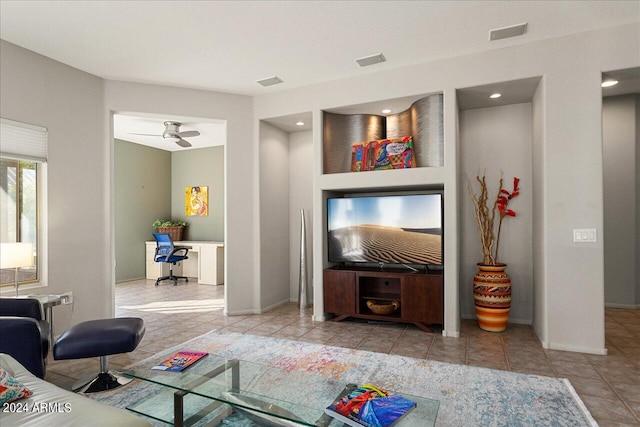 living room with light tile patterned flooring and ceiling fan