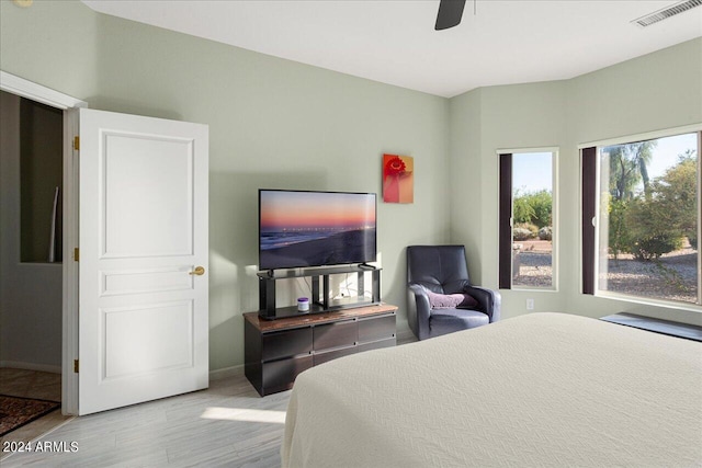 bedroom featuring light wood-type flooring and ceiling fan