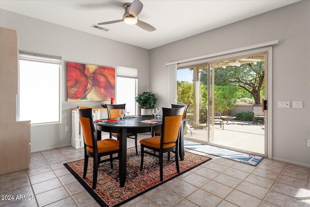 dining room with ceiling fan and light tile patterned floors