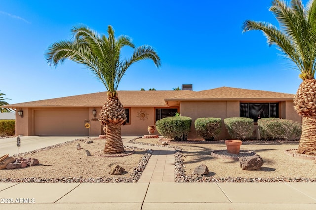 ranch-style home with a garage