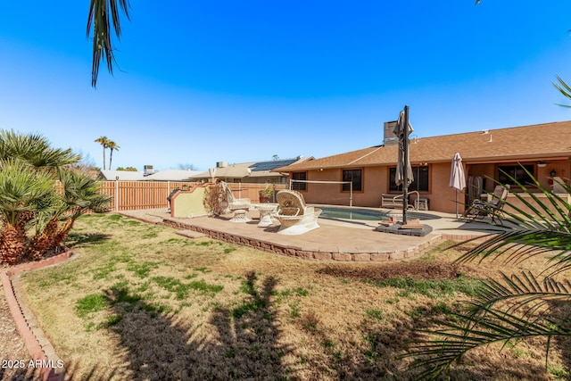 rear view of property featuring a patio area